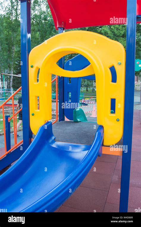 Colorful Childrens Playground With Slides And Swings Outdoors In The