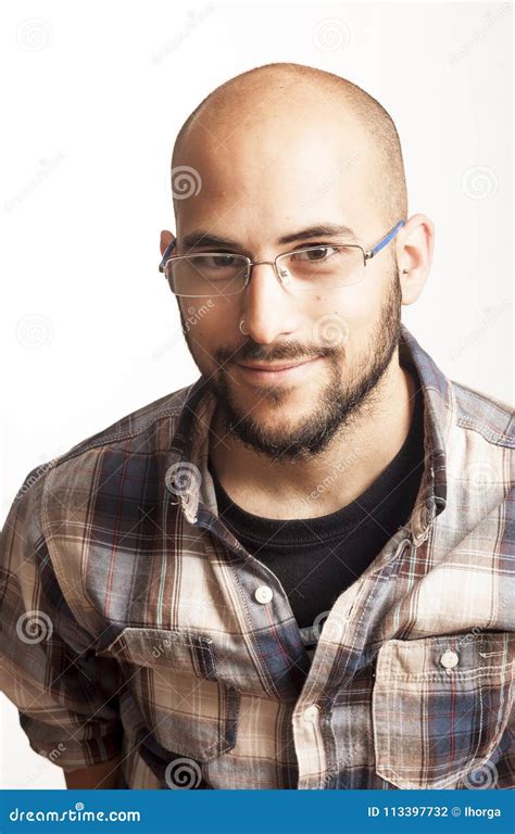 Portrait Of A Young Bald Man With A Beard And Glasses Stock Photo