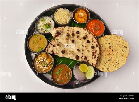 North Indian Thali Top View Roti Pappad Rice And Variety Of Curries