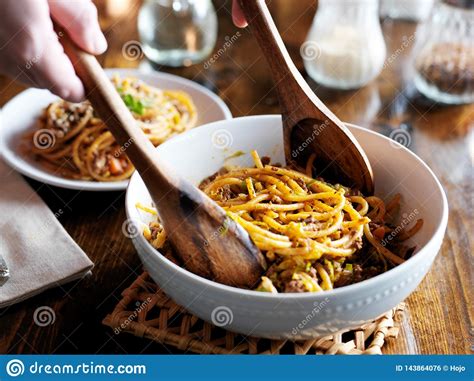 Serving Spaghetti with Wooden Spoons Out of Bowl Stock Photo - Image of ...