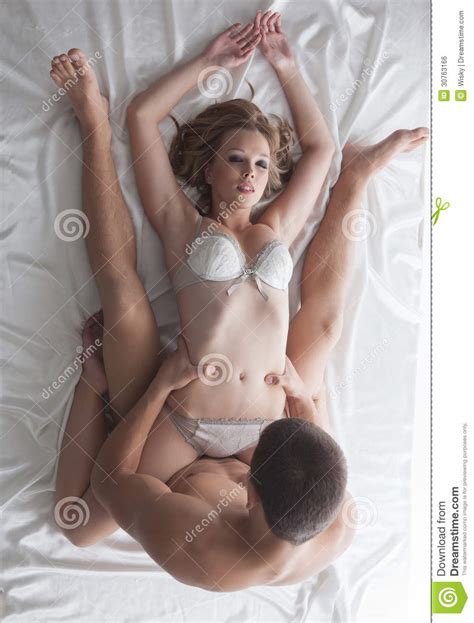 Young Attractive Couple Having Foreplay In Bed Royalty