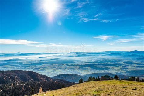 Landscape Of A Valley Blue Sky And The Sun From A Mountain Stock Photo