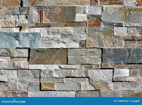Stone Wall Cladding Made Of Natural Rocks Bricks With Different Sizes