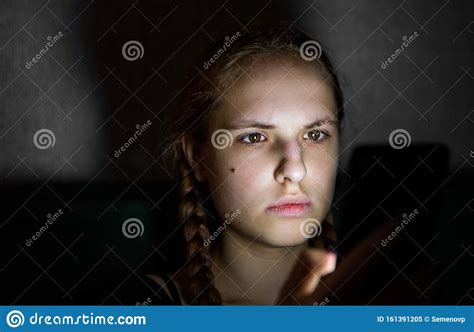 Young Teenager Redhead Girl With Long Hair With Smartphone In Dark Room Stock Image Image Of