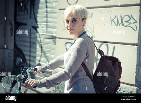 Beautiful Young Blonde Short Hair Hipster Woman Witk Bike In The City