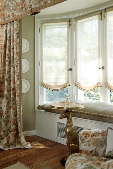 Whether your bay windows flood your living room with sunlight during the day or allow a cozy view into your yard from a breakfast nook in the kitchen, bay windows make an impressive impact. Bay Window Curtain Ideas in 2020 | Window treatments living room, Bay window treatments, Bow window