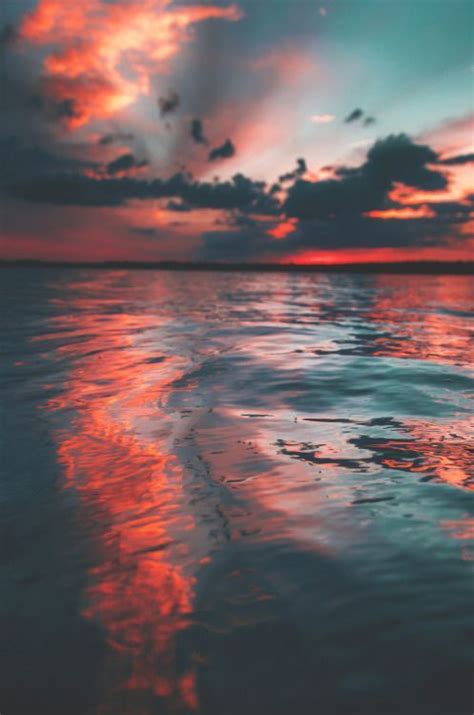Coastal Photo Of The Sunset Sky Reflected In The Water