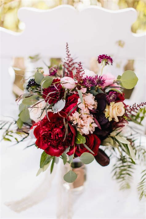 This fall hydrangea wedding bouquet in purple colors looks a bit mysterious, but is very cool. Bouquets Photos - Wine Colored Bouquet - Inside Weddings