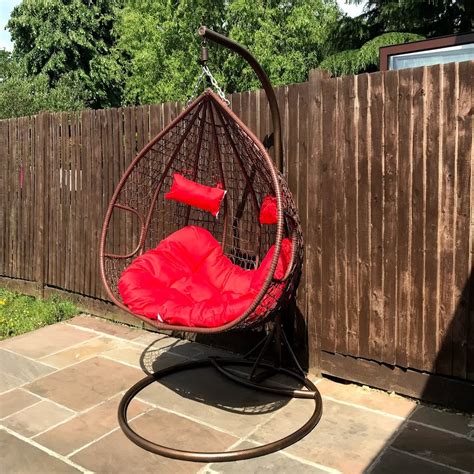 Brafab 2 person double swing chair hanging egg chair rattan wicker hammock with stand and cushion aluminum frame grey cushion 4 8 out of 5 stars 6. Double Outdoor Rattan Hanging Egg Chair- Red Cushions - Nitaar