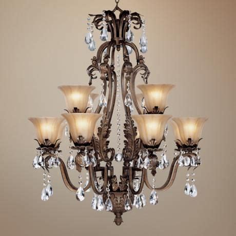 This small crystal chandelier is beautifully crafted in a restoration look of yester year. Iron Leaf 34" Wide Bronze and Crystal 12-Light Chandelier ...