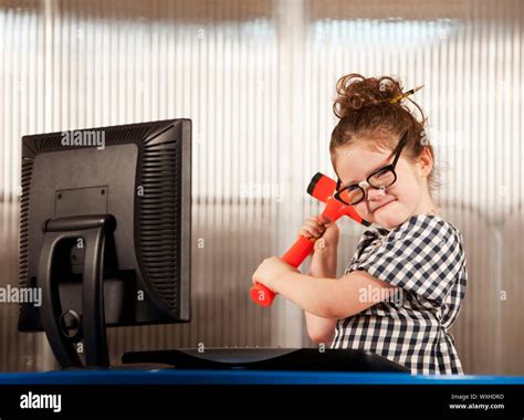 Nerdy Young Girl Smashing Her Computer With A Hammer Stock Photo Alamy