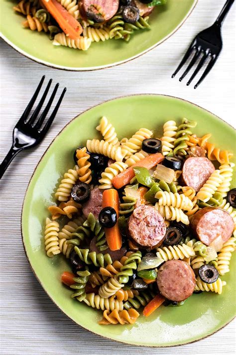 Meanwhile, in a large skillet, saute the sausage, carrots, green pepper and onion in oil until sausage is browned and vegetables are tender. Smoked Sausage Pasta Salad - Homemade Hooplah