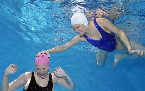 Pin By Silly Billy On Women Fighting With Bathing Caps Underwater