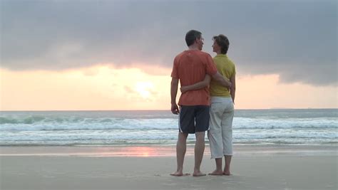 Romantic Couple On Beach Running Having Fun In Love On