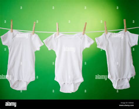 Close Up Of Baby Clothes Hanging On Clothesline Stock Photo Alamy