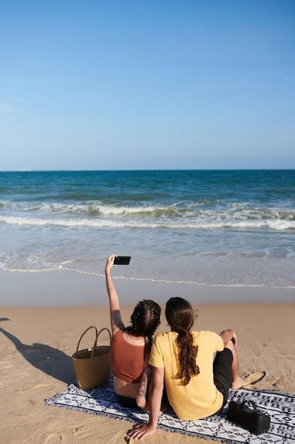 Premium Photo Couple Taking Selfie On Beach