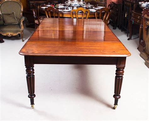 This dining set includes a table, four side chairs and bench. Antique Regency Mahogany Dining Table Eight Admiralty Chairs For Sale at 1stdibs