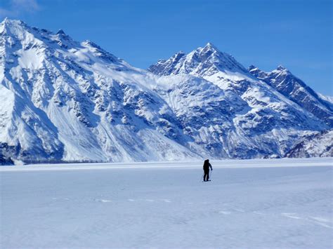 Frozen Crescent Lake Landscape With Mountains In The