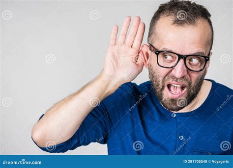 Man Eavesdropping With Hand Close To Ear Stock Photo Image Of