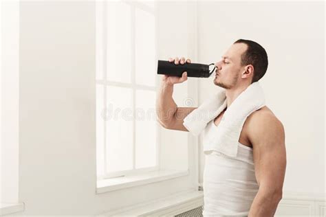 Male Bodybuilder Drinking Water After Workout Stock Photo Image Of