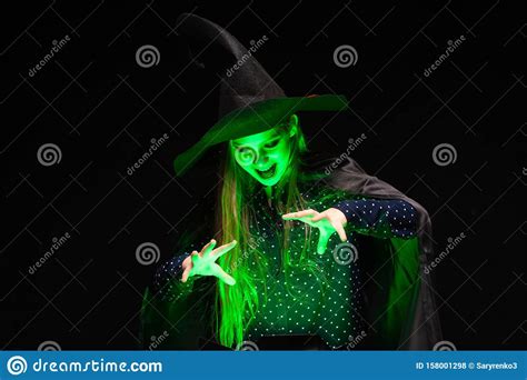 Halloween Witch Over A Pot Of Green Glowing Liquid Conjures Hands On