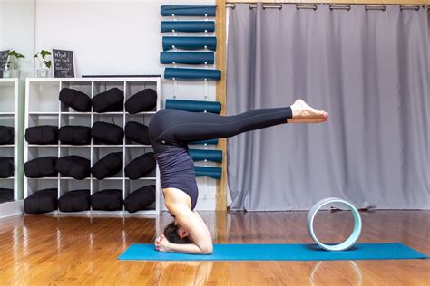 Practicing Your Headstand With A Yoga Wheel Yoga Direct Yoga Wheel