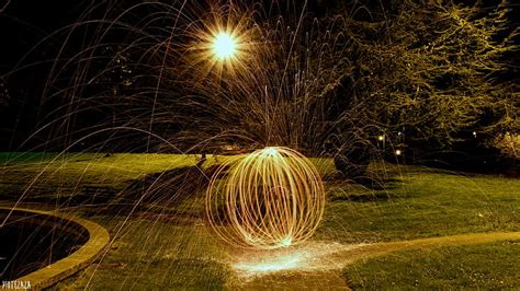 Hd Wallpaper Light Painting Lights Night Sphere Sparks Nature Grass