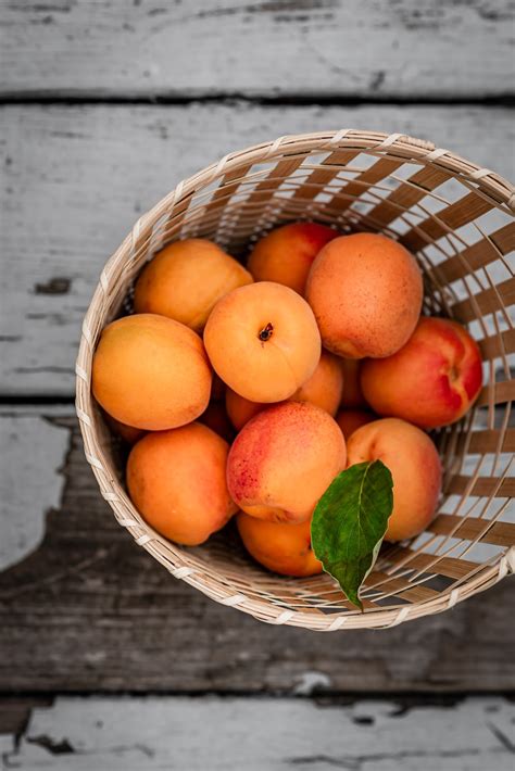 A Basket Filled With Lots Of Ripe Peaches Photo Free Clean Eating