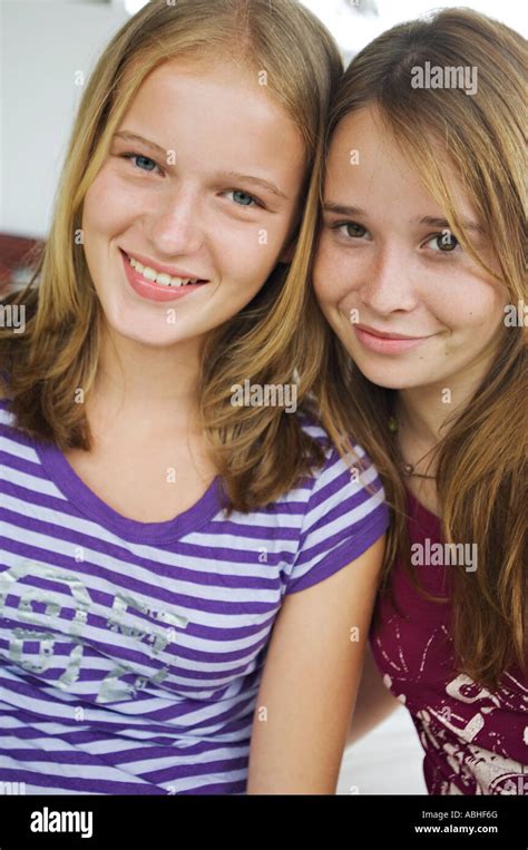 Portrait Of 2 Smiling Teenage Girls Stock Photo Alamy