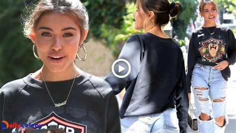 Madison Beer Flashes Her Derriere In Ripped Jeans And Tasmanian Devil Sweater While Out In La