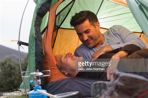Male Couple Camping Resting In Tent ストックフォト Getty Images
