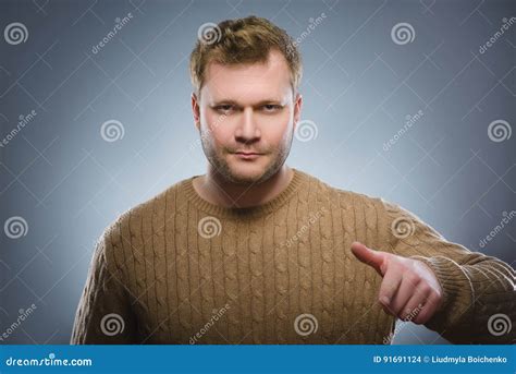 Portrait Handsome Young Smiling Man Pointing Fingers At Camera Isolated