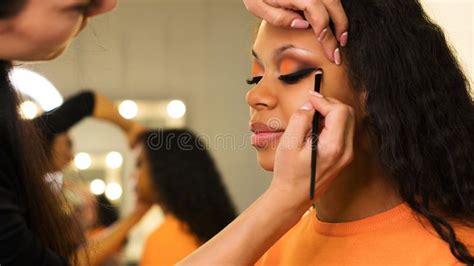 makeup artist applies makeup on face of girl stock image image of makeover afro 149672589