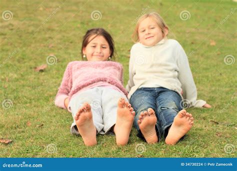 Girls With Smileys On Toes Stock Photo Image Of Green 34730224