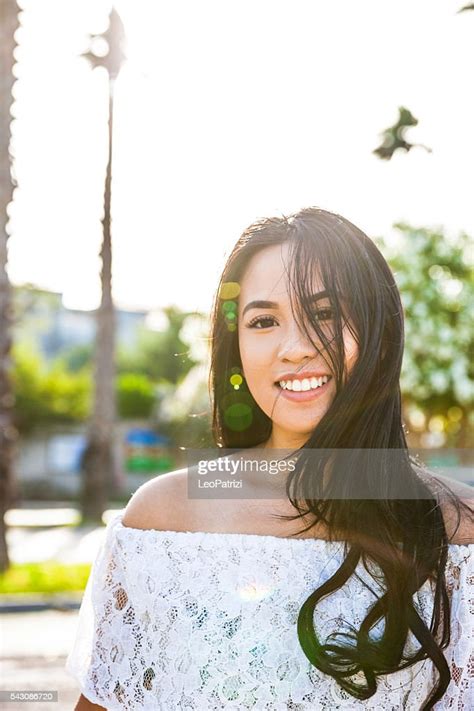 Young Filipino Woman Portrait Looking At Camera Outdoor High Res Stock