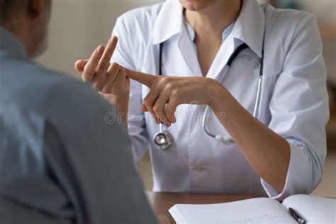 Close Up Of Female Doctor Consult Mature Patient Stock Image Image Of