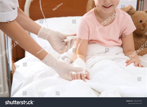 Doctor Adjusting Intravenous Drip Little Child Stock Photo 1306493593