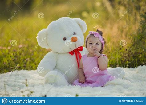 Little Girl With A Big Teddy Bear Stock Photo Image Of People