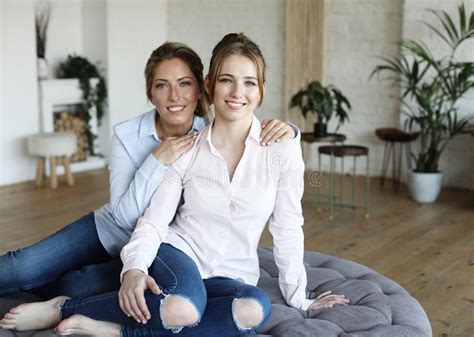 Happy Senior Mother Embracing Adult Daughter Laughing Together Stock Image Image Of Home