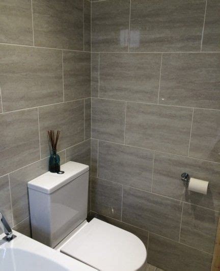 The effectiveness of wood tile bathroom ideas can be uncanny. Potential colour scheme with only one wall darker tiles ...