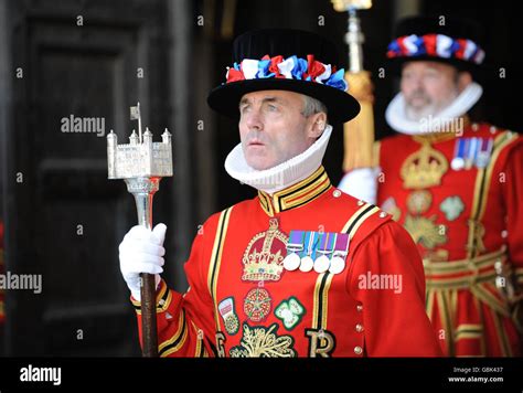 Yeoman Warders Stand At The Entrance To Westminster Abbey Awaiting The