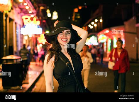 A Woman Standing On Bourbon Street In New Orleans Stock Photo Alamy