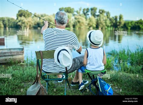 Grandfather Grandson Fishing Together Lakeshore Hi Res Stock