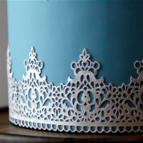 Create your own winter wonderland cake with this lovely ensemble! Global Sugar Art Regal Crown Lace Silicone Lace Mat by ...