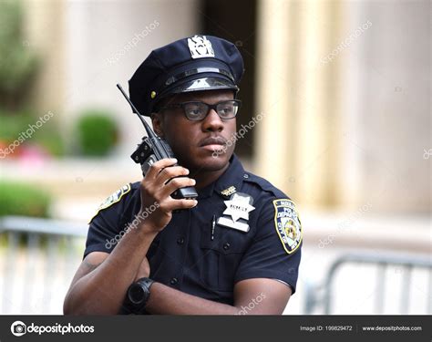 Police Officer Performing His Duties On The Streets Of Manhattan New