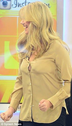 Kate Upton Nearly Pops A Button As Her Shirt Struggles To Contain Her