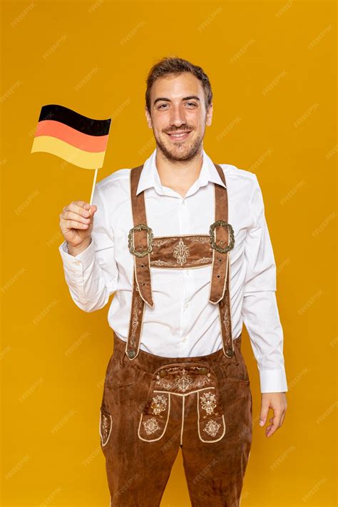 Free Photo Medium Shot Of Man Holding German Flag
