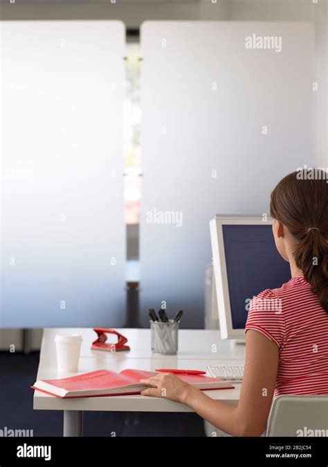 Businesswoman At Desk Back View Stock Photo Alamy
