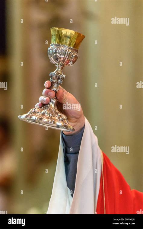 Priest Giving Eucharist Stock Photo Alamy
