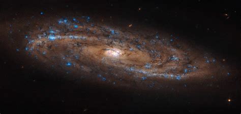 Hubble Views A Beautiful Stretched Spiral Galaxy Skyatnightmagazine
